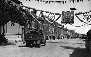 Police Prints: The Belfast Riots; Troops Called Out -- A police truck passing under the welcoming sign of the 12th July Orange Day