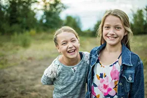 Playful Prints: Best girlfriends, laughing and smiling outdoors in nature