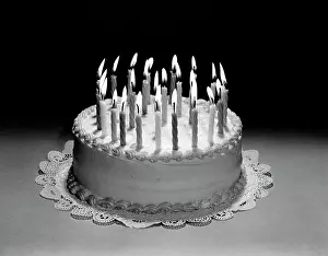 Celebrate Prints: Birthday Cake Still Life With Many Lit Candles On Top Of Doily