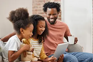Smart Prints: Black family, kids and tablet for education