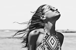 Chic Prints: Black and white outdoor fashion photo of beautiful happy woman at sea