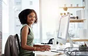 Black woman in business, computer screen and smile in portrait