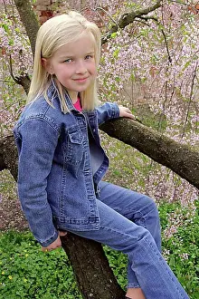 Fair Skinned Prints: Blond girl sitting on tree branches