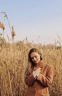 Blonde Hair Prints: Blond girl walk in pampass autumn grass