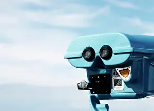 Observation Prints: Blue lookout binoculars against blue cloudy sky