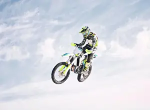 Biking Prints: Blue sky, jump and man on motorbike in air for practice