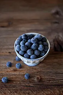 Blueberries Prints: Blueberries in a small bowl on a rustic wooden table