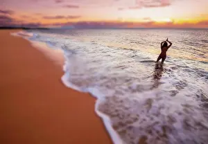 50 54 Years Prints: A blurred image of a woman standing in the surf
