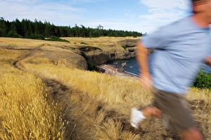 Runner Prints: Blurred runner on trail, Hornby Island at Helliwell Park