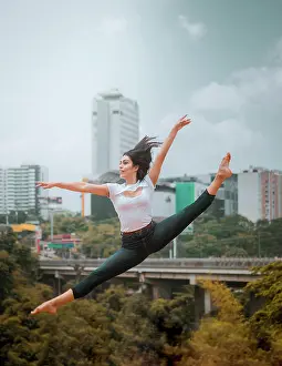 Talent Prints: Full body energetic barefoot woman in casual clothes jumping