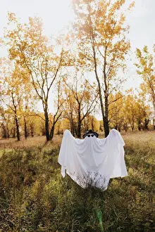 Looking Ahead Prints: Full body image of person dressed as ghost looking at camera