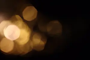 Round Prints: bokeh warm light on black background overlay