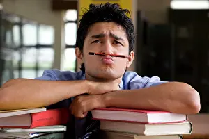 Students Prints: Boy balancing a pencil between his nose and mouth