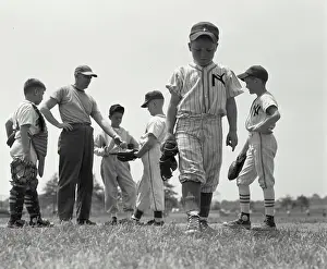 Baseball Cap Prints: Boy expelled from youth league walking away from his team and coach