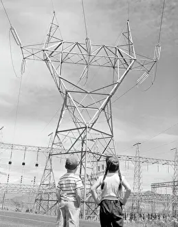 Contemplating Prints: Boy and girl looking at electricity pylon
