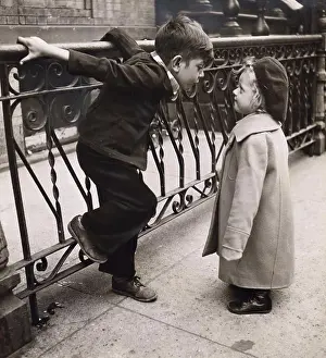 Walkway Prints: Boy and girl standing face to face next to railing