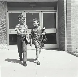 Carry Prints: Boy and girl walking together