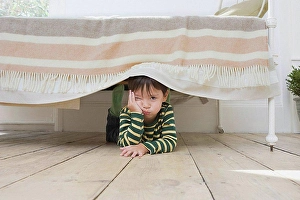 Orient Prints: Boy hiding under a bed