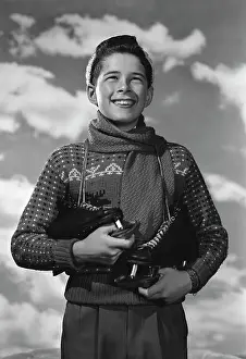 Sweater Prints: Boy with ice-skates looking away and smiling