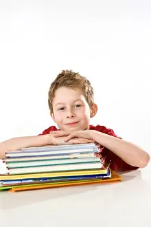 Diagonal Prints: Boy leaning on books and smiling