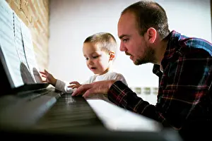 Instrument Prints: Boy playing piano with parent