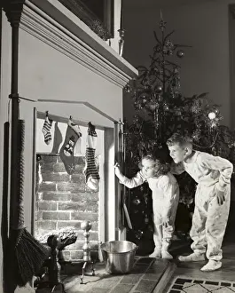 Curiosity Prints: Boy and his sister peeking into a fireplace