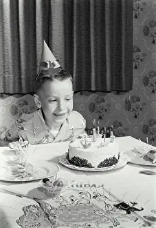 One Child Only Prints: Boy sitting in front of a birthday cake
