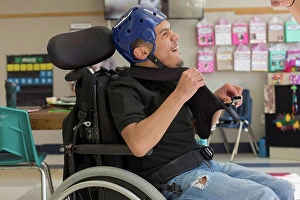 Cerebral Palsy Prints: Boy with Spastic Quadriplegic Cerebral Palsy using using his special needs helmet