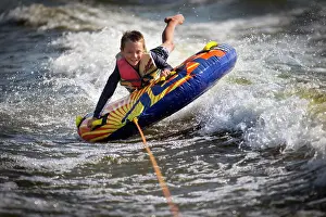 Outdoor Pursuit Prints: Boy tubing on river