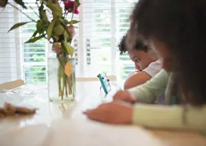 Video Prints: Boy with video game controller at table