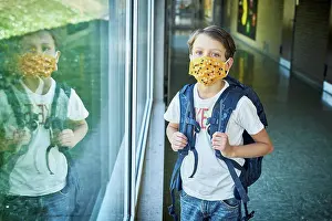 Secure Prints: Boy wearing mask in school mirrored in window