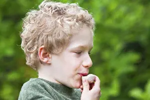 Speak Prints: Boy whistling with a snail shell