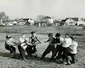 Rope Prints: Boys pulling rope on field