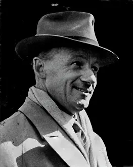 Newspaper Prints: The Bradman Smile -- Skipper Don Bradman brings a 'new look' of his own as he arrives with the seventeen