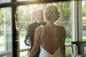 Bald Prints: Bride and father of the bride about to embrace celebrating the wedding day