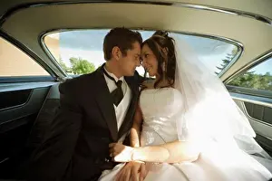 Relationships Prints: Bride and groom inside wedding car