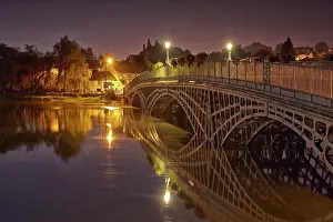 Land Scape Prints: Bridge over river during high tide at twilight