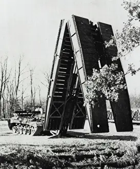 Bride Prints: Bridging A Gap -- An experimental scissors-type bridge which is carried and launched by a turret-less tank