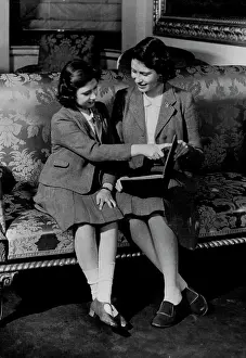 Her Majesty Prints: The British Royal Family -- The two girls sitting on this couch are Princess Elizabeth