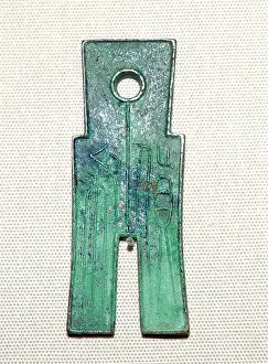 Money Prints: Bronze hoe coin, worth 25 standard coins. Wang Mang (AD 9-23)