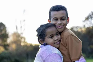 Mixed Prints: Brother and Sister hugging lovingly