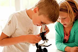 Curiosity Prints: Brother and sister looking through a microscope