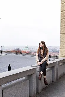 Ambiance Prints: brown-haired woman in a coat on the streets of a European city