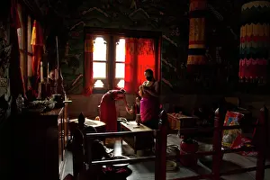 Medium Group Prints: Buddhist monks from Bhutan make candles in their Bhutan Temple in Bodh Gaya