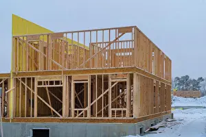 Carpentry Prints: Building frame structure on a new development timber frame for a progressing house