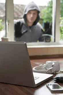 Gloves Prints: Burglar Looking At Valuables Through House Window