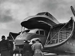 Aviation Prints: Buses Flown By Air -- Shipping Shortage has forced Pioneer Tours to air-freight 10 new 2¾-ton buses to Tasmania for