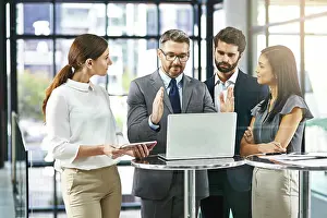 Business man, laptop and meeting with team for presentation of ideas