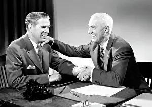 Greeting Prints: Two business men shaking hands in office