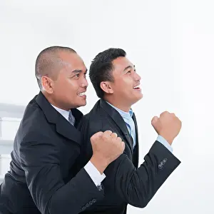 Handel Prints: Business people celebrating success Southeast Asian businessmen celebrating success in office